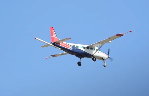 Single-engine fixed-wing survey aircraft with a magnetic sensor boom extending behind the fuselage