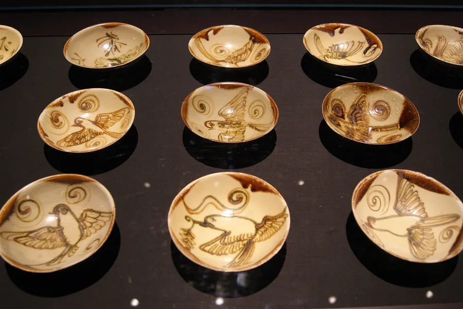 Changsha ware bowls recovered from the Belitung shipwreck, on display at the ArtScience Museum in Singapore