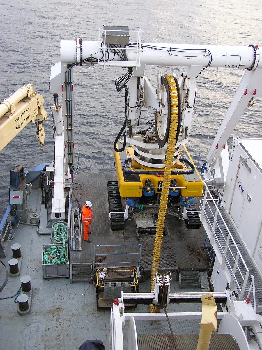 An ROV being launched from a cable ship for subsea cable system work