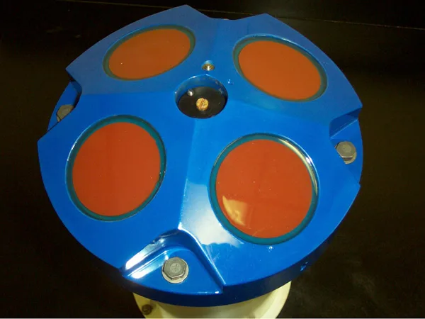Close-up of a Doppler instrument sensor head showing its four angled transducer faces in a Janus-style configuration