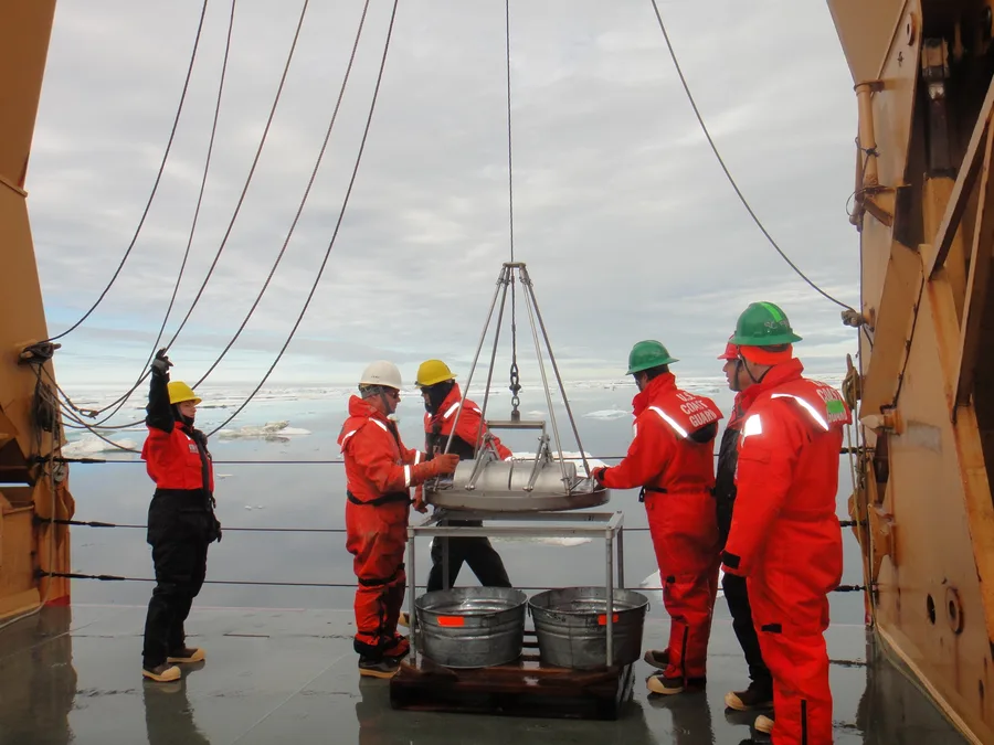 Van Veen grab sampler being deployed to collect seafloor sediment samples