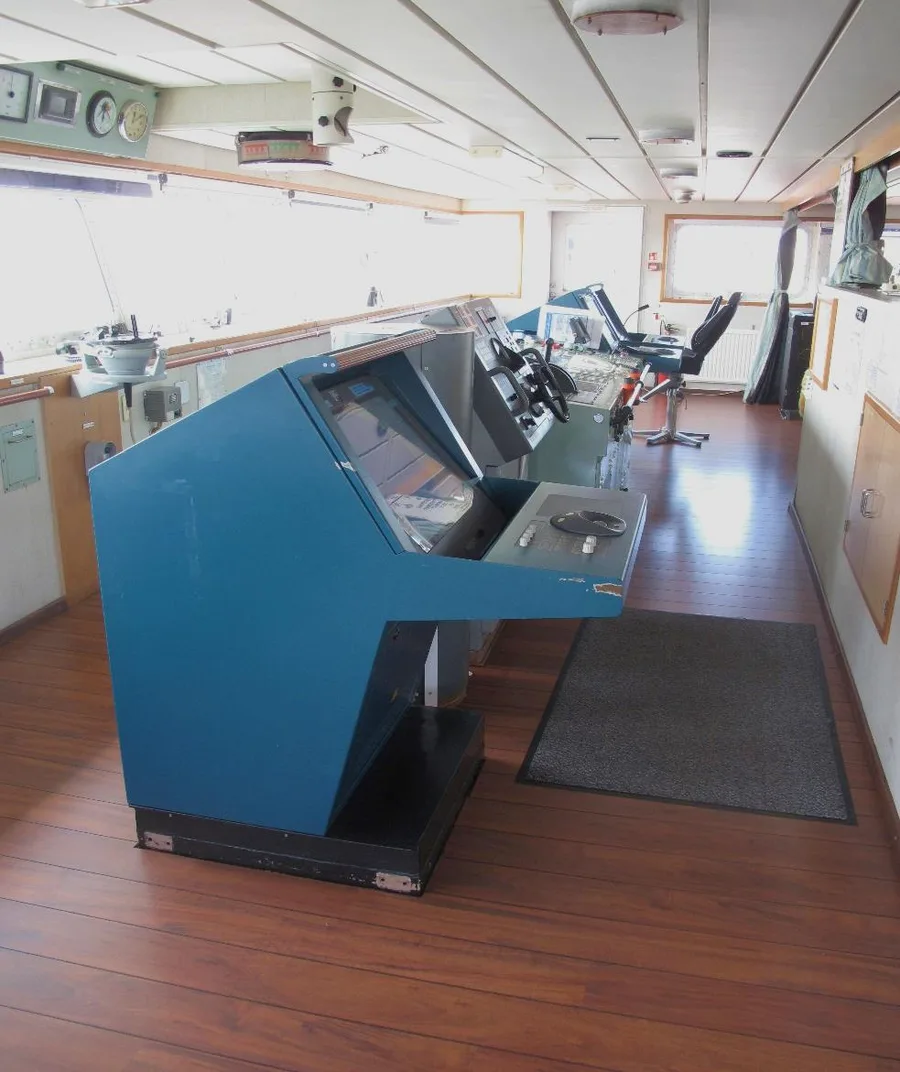 ECDIS and radar consoles on the navigation bridge of the container ship Carla Maersk