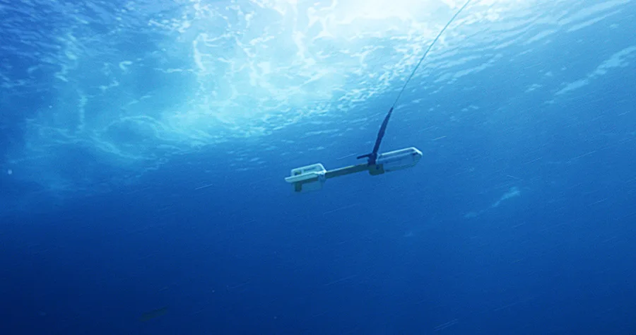 A marine magnetometer being towed behind a survey vessel