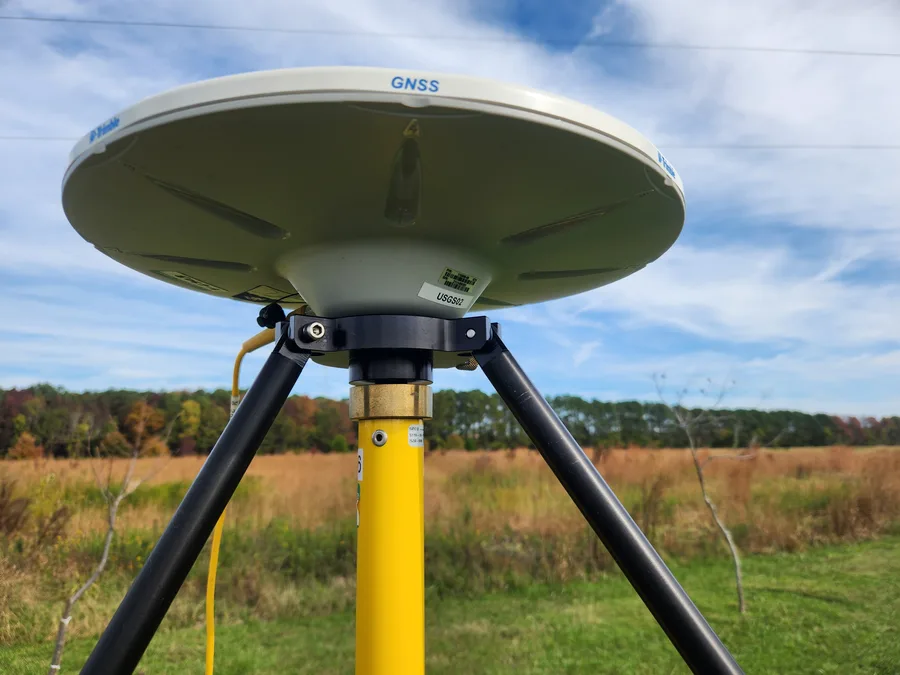 A GNSS receiver mounted on a tripod for geodetic survey