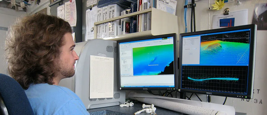 A hydrographer reviewing multibeam sonar data before it is finalized into a client deliverable