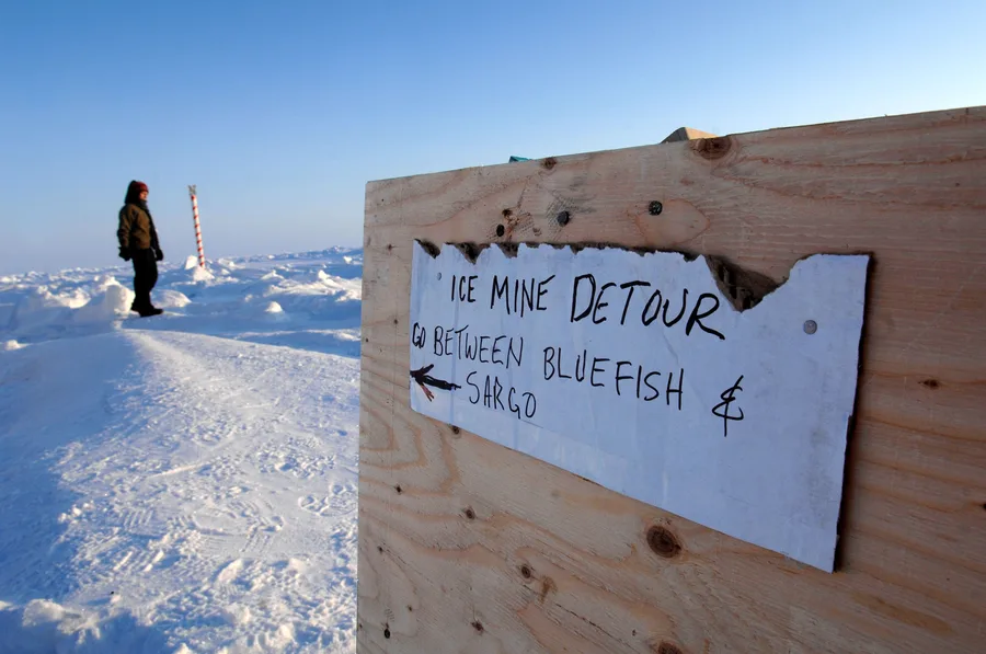 US Navy and University of Washington Applied Physics Laboratory personnel at an Arctic ice camp mining ice for fresh water